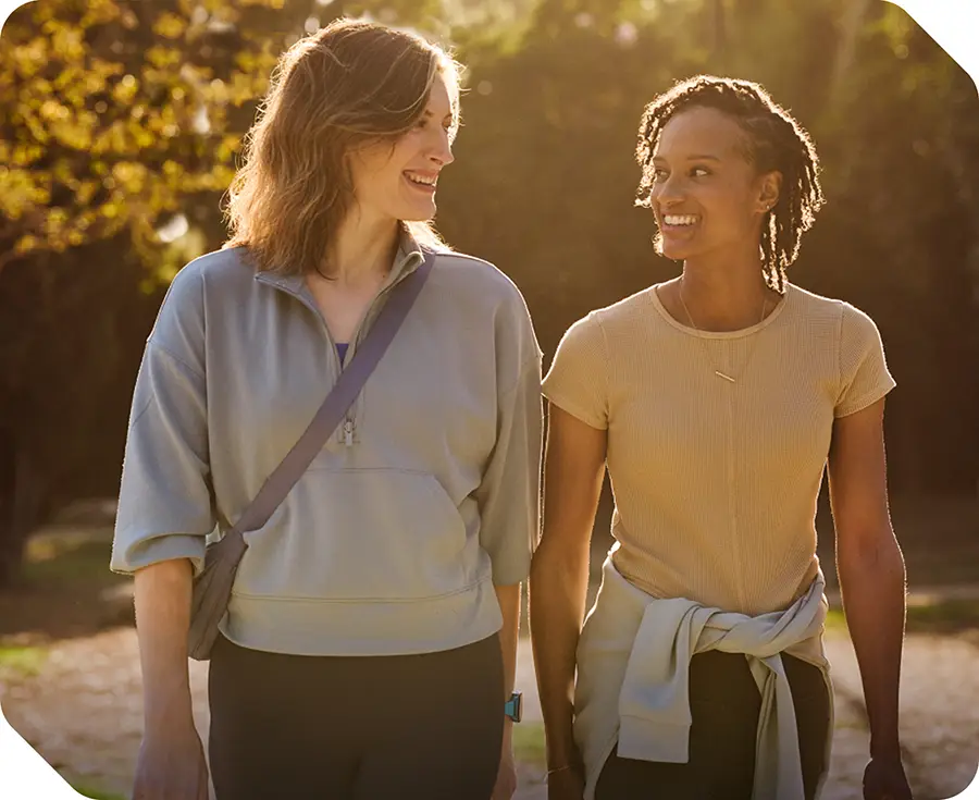 Image of Megan, a real acromegaly patient walking with a friend.