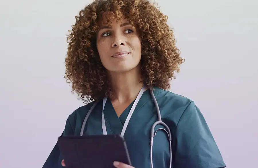 Nurse with tablet device.